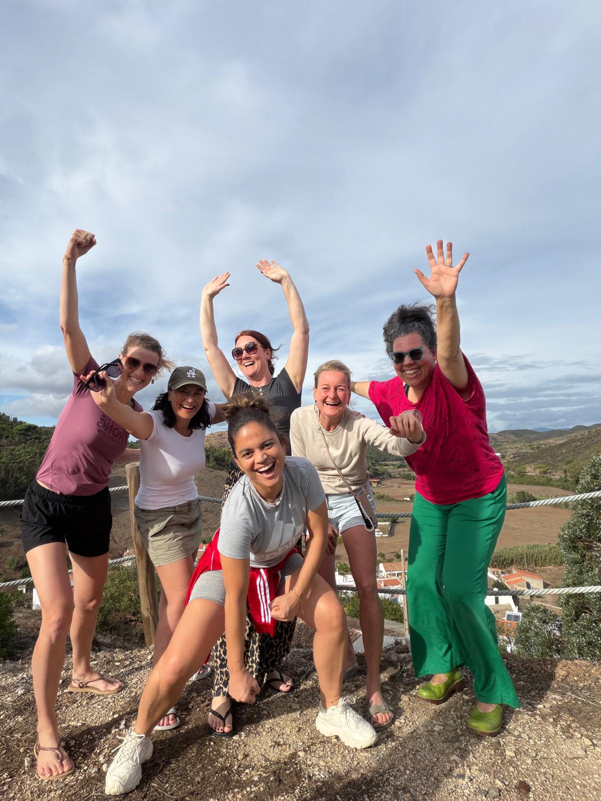 Pause retreat women having fun together on the beach